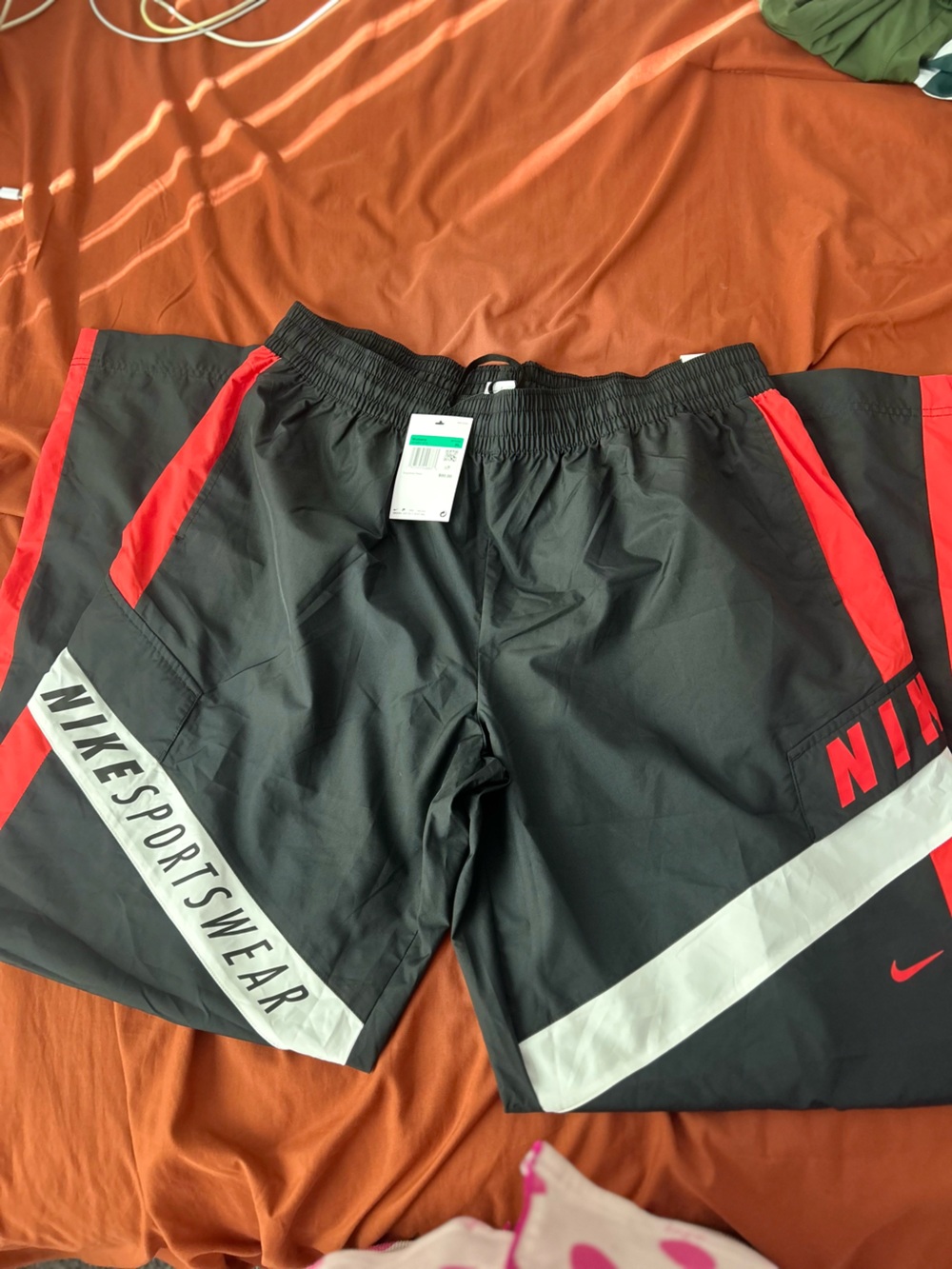 Nike Black Swim Shorts with Red and White Accents